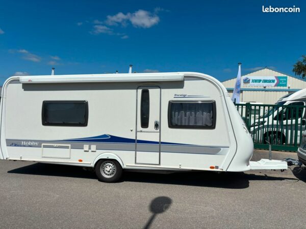 Caravane hobby 540 prestige - deplace caravane - lits jumeaux - salon en u - store banne et parois laterales